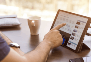 Man Looking At Search Results On Tablet