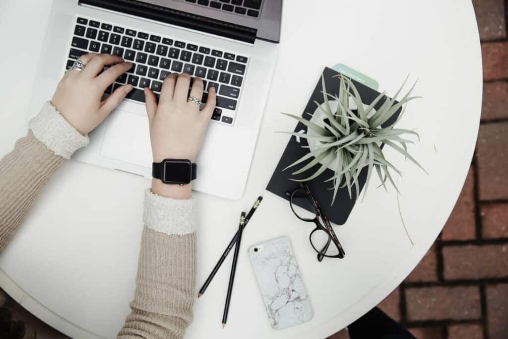 Image of person using a laptop to do work from home office