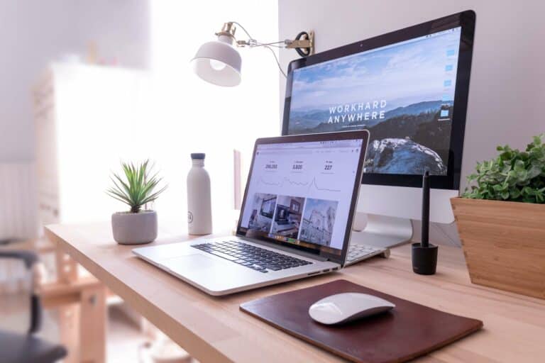 Laptop and Desktop Computer on Desk in Home Office