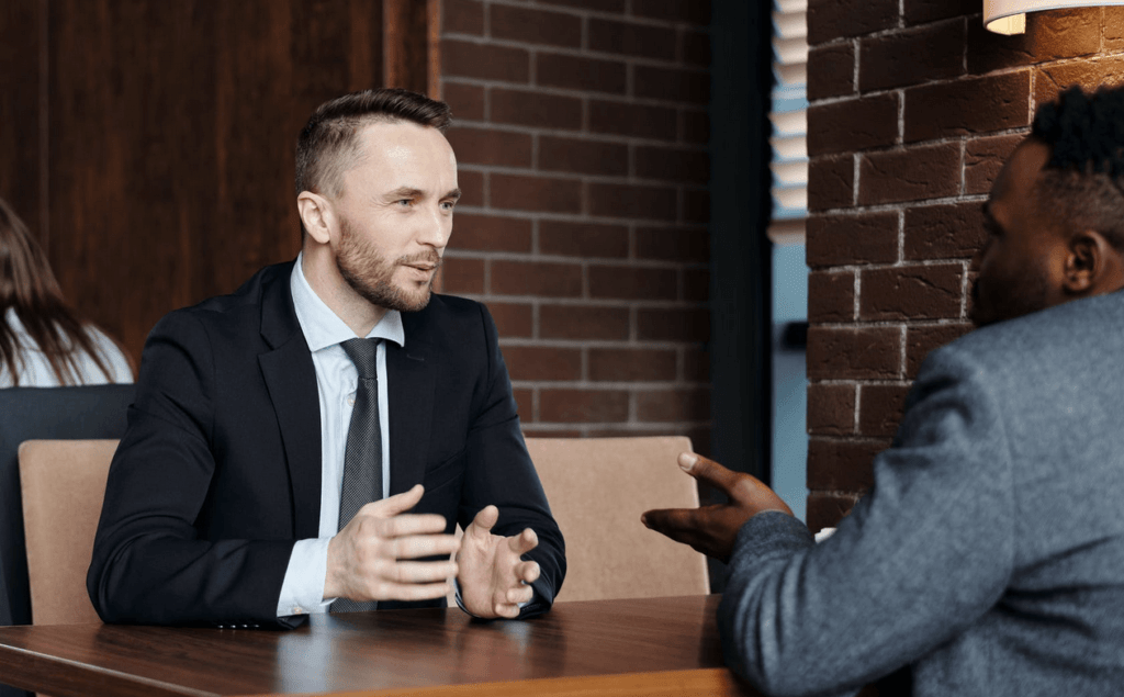 Two businessmen discussing something in meeting